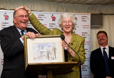 Alison Cox MBE presents the painting to Sir Roger Gale MP
