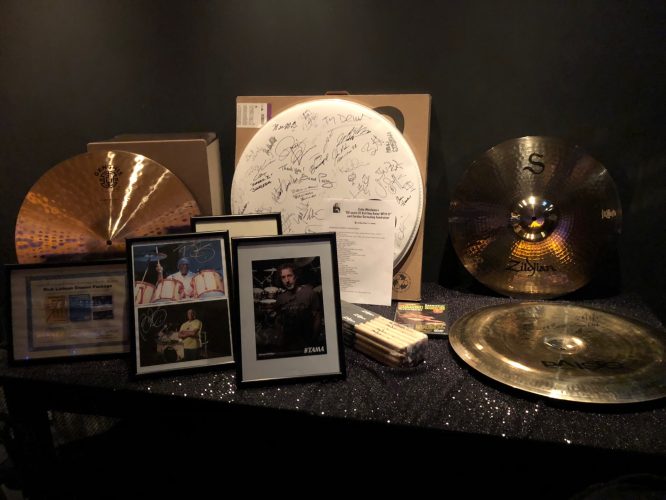 Auction items including photos and cymbals signed by famous drummers from all over the world!