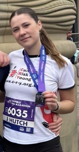Jess-Hutchins-run-with-medal.jpg